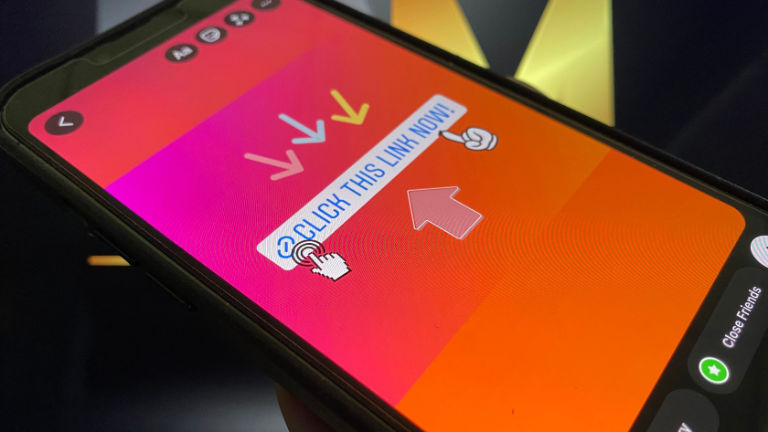 Phone screen with a bright gradient background and a blue banner that says 'Click this link now!' with cursor icons nearby (CTA prompt). If this is a link, this text indicates the action to take.