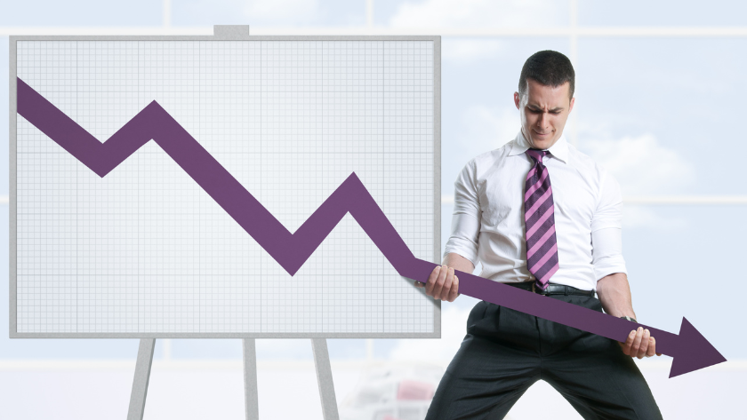 Businessman in a white shirt and striped tie pulls down a large purple downward-trending arrow on a grid chart, illustrating a decline in performance.