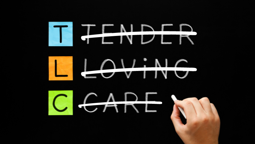 TLC letters on colored blocks with the words 'Tender', 'Loving', and 'Care' crossed out by a hand.