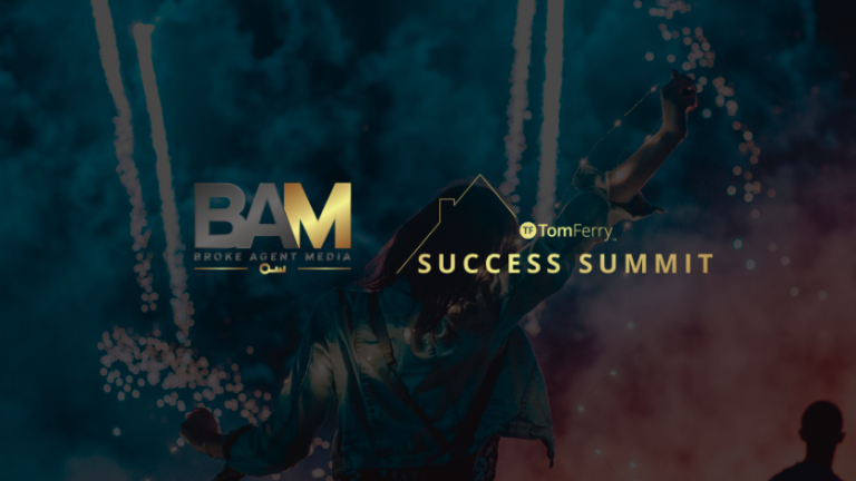 Person with arms raised at a fireworks-lit event banner reading BAM Success Summit, conveying celebration and achievement in an event context.