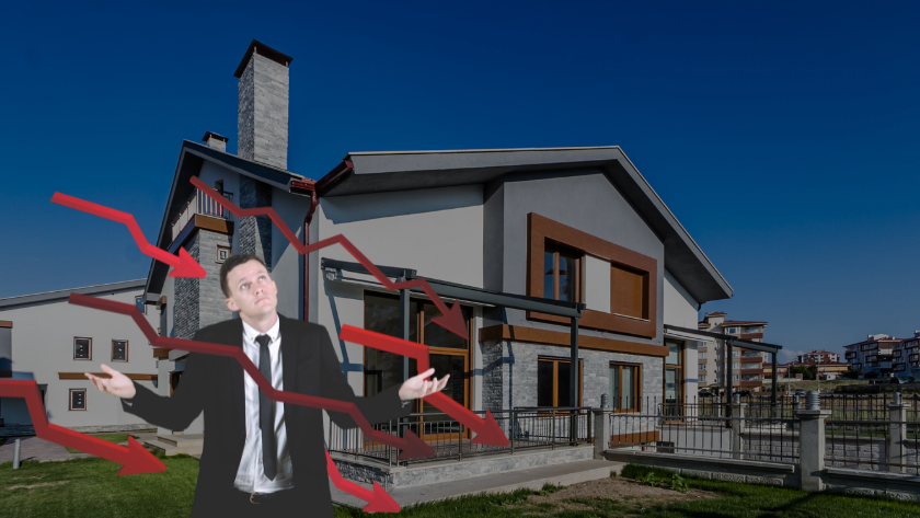 Businessman in a suit stands with a puzzled expression as red stock arrows crash downward over a modern house in the background.