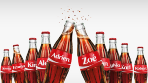 Row of glass Coca-Cola bottles with red name labels, tilted together in the center (Adrien and Zoe prominent)