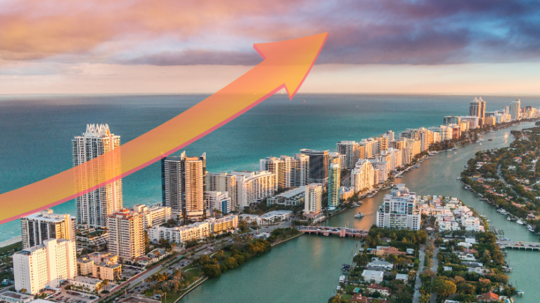 Aerial view of a coastal city skyline with tall buildings and a large orange upward arrow, signaling growth.