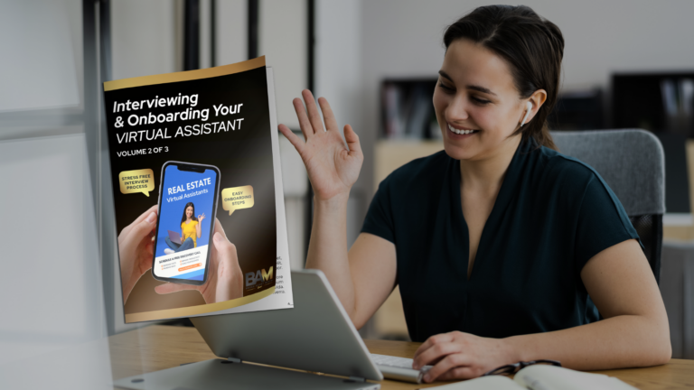 Smiling woman at a desk wearing wireless earbuds waves hello; a poster about interviewing virtual assistants is beside her.