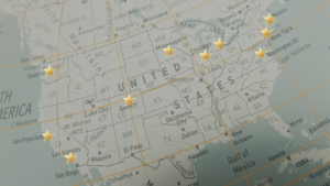 Map of the United States with gold stars marking major cities across the country, from Seattle to Miami.