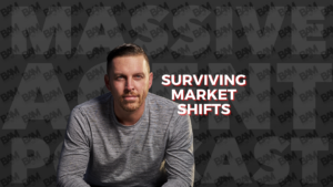 Portrait of a man in a gray shirt seated to the left, next to the title 'Surviving Market Shifts' on a dark patterned background.