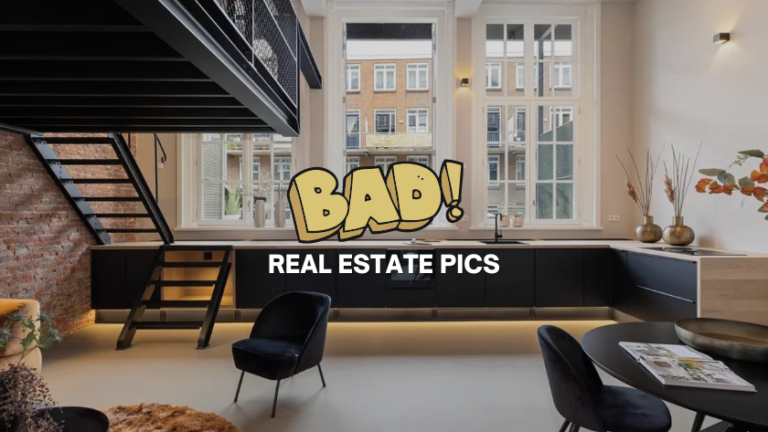 Modern loft interior with brick wall, black cabinetry, metal staircase, large windows, and a bold 'BAD!' with 'REAL ESTATE PICS' overlay.