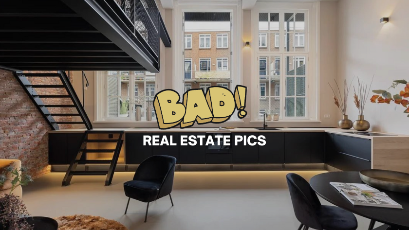 Modern loft interior with brick wall, black cabinetry, metal staircase, large windows, and a bold 'BAD!' with 'REAL ESTATE PICS' overlay.