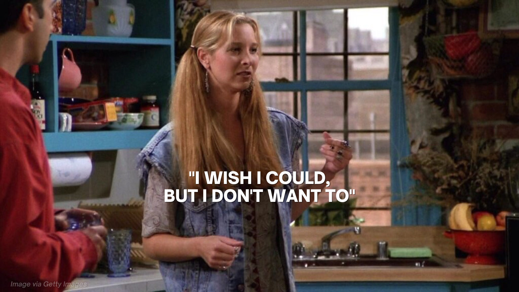 Woman in a denim vest speaks in a kitchen, with a bold meme-style caption: “I wish I could, but I don’t want to.”