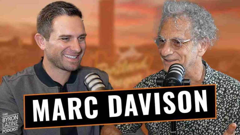 Two podcast hosts with microphones; a bold 'MARC DAVISON' banner runs across the foreground as they smile and chat.