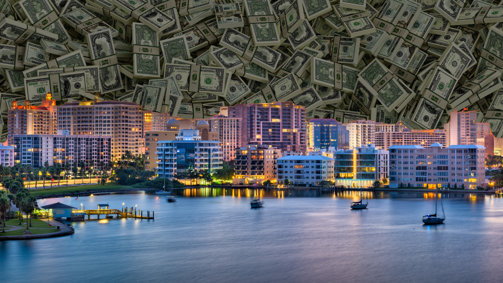 City waterfront with illuminated buildings at dusk and boats on calm water, dollars filling the sky to symbolize wealth and real estate