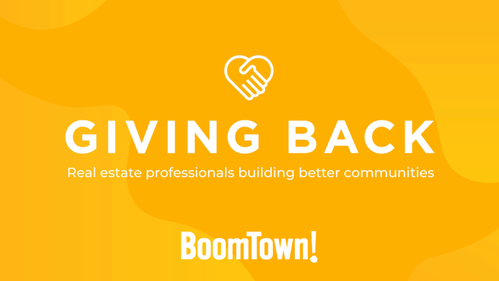 Orange hero with a white heart-shaped handshake icon, the bold text 'GIVING BACK' and the subtitle 'Real estate professionals building better communities', BoomTown! at the bottom.