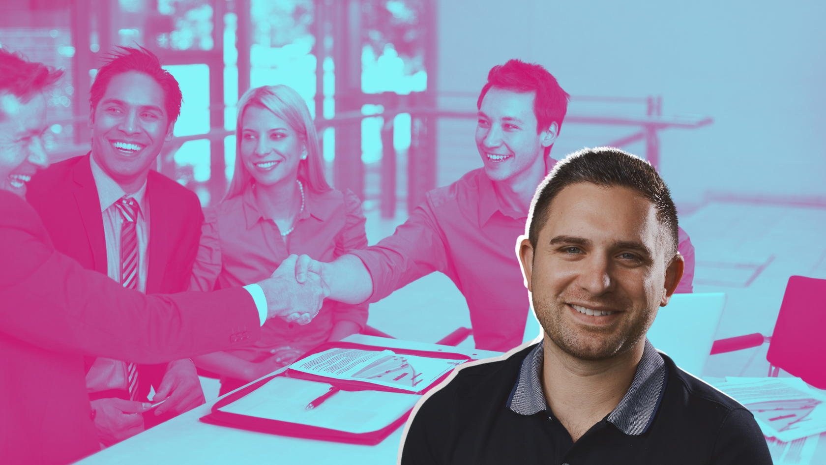 Smiling man in foreground with a group of colleagues shaking hands in the background, signaling a successful business partnership.