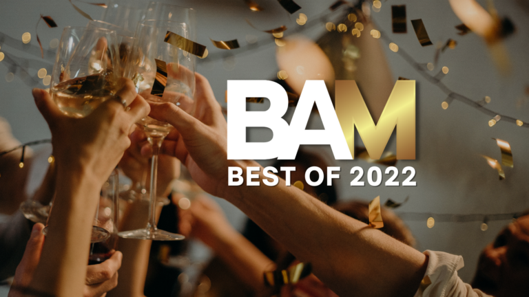 People raising champagne glasses in celebration with gold confetti, overlaid 'BAM Best of 2022' text.