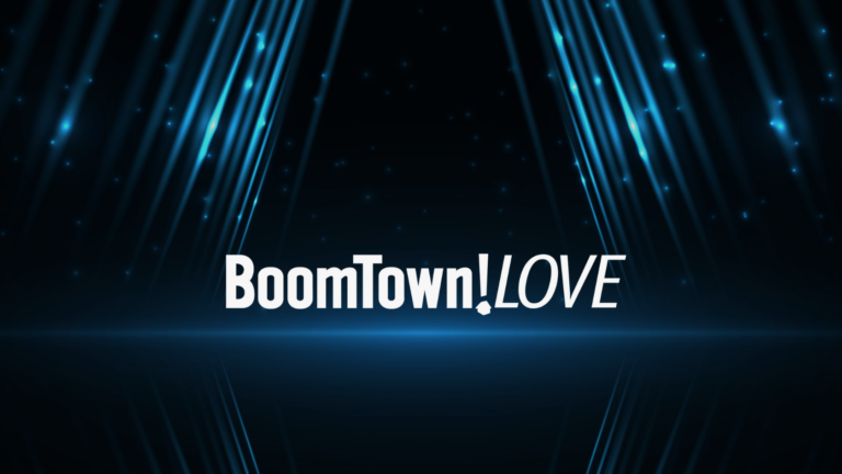 Logo with the text 'BoomTown!LOVE' in bold white font on a dark blue neon background with surrounding light beams.