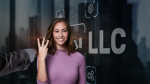 Smiling businesswoman in a pink sweater being touched on the cheek by a colleague, with a futuristic digital interface background showing 'LLC' text.
