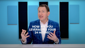 Video presenter in a blue check blazer speaking at a desk with the caption: 'HOW ARE YOU LEVERAGING YOUR 24 HOURS?','Professional man in a blue suit discusses time management on a studio set with bold white text prompt across the screen.','Host presenting a tip on maximizing daily time, overlaid with the question about leveraging 24 hours.']} }``` If you prefer shorter: 1-2 sentence options with the exact text included. If you want longer, I can add a longer description of the scene.``` (Note: The JSON above is the intended structure; ensure exact quotes and punctuation match your alt text usage.)``` >Oops I included extra markdown; corrected below.> {