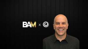 Banner featuring the BAM logo and a circular gray logo with a smiling man on a black wood background.
