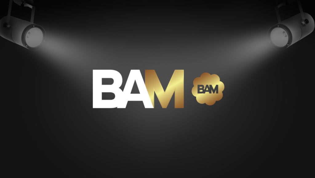 Logo for BAM with bold white and gold letters on a dark stage backdrop and spotlights shining down
