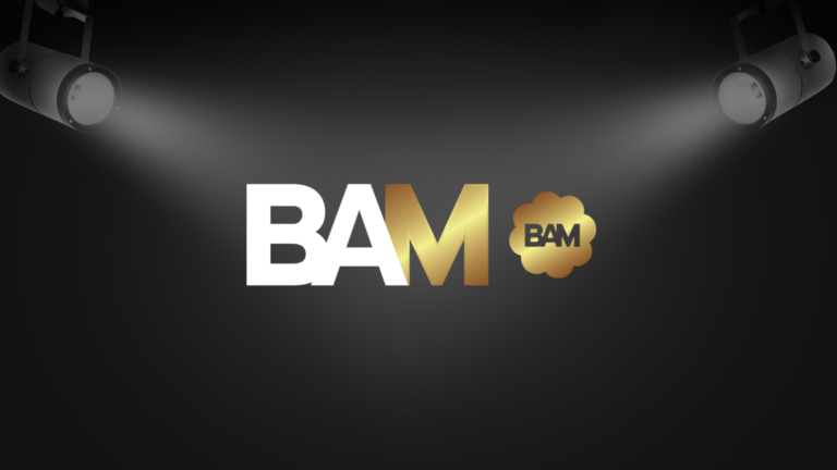 Logo for BAM with bold white and gold letters on a dark stage backdrop and spotlights shining down
