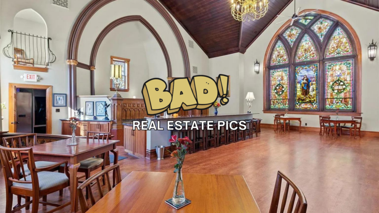 Interior of a large, church-like room with dark wood arches, stained-glass windows, and wooden tables; bold overlay reads 'BAD! REAL ESTATE PICS'.