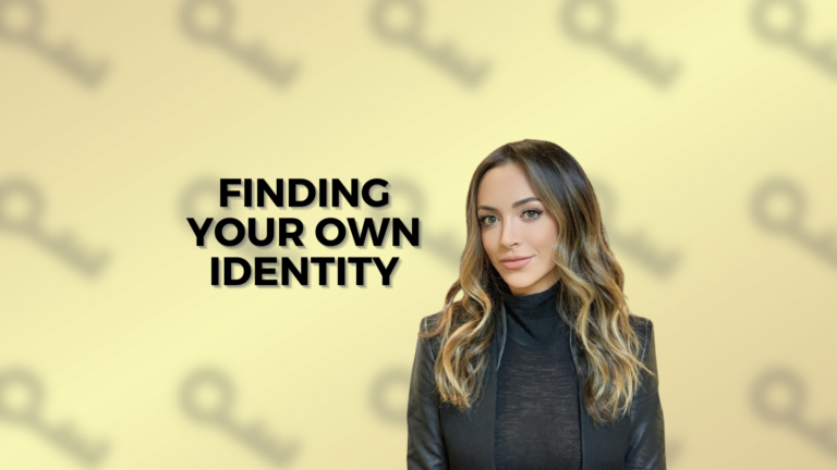 Woman in a black blazer stands against a pale yellow background with bold text: 'FINDING YOUR OWN IDENTITY' to her left.