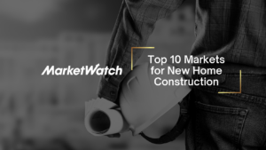 MarketWatch hero banner with the article title 'Top 10 Markets for New Home Construction' over a grayscale construction scene showing a worker holding a hard hat and blueprints.
