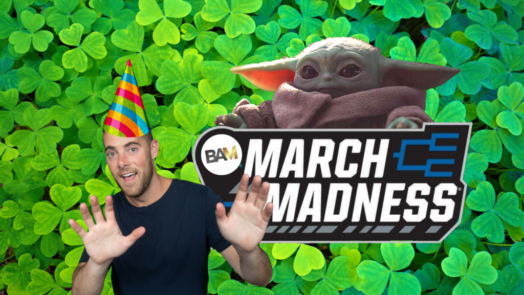 Man with a rainbow party hat waving beside Grogu and a March Madness banner amid green shamrocks background.
