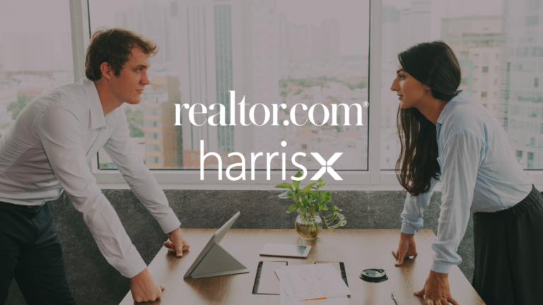 Two colleagues lean on a conference table in a bright city-office, with realtor.com and HarrisX logos overlaid on the image.