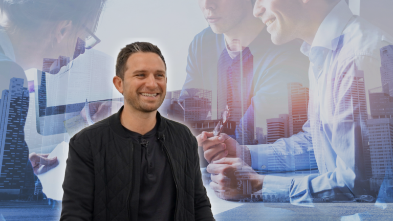 Smiling man in a black quilted jacket in the foreground with a translucent collage of colleagues and a city skyline in the background, suggesting teamwork in business.
