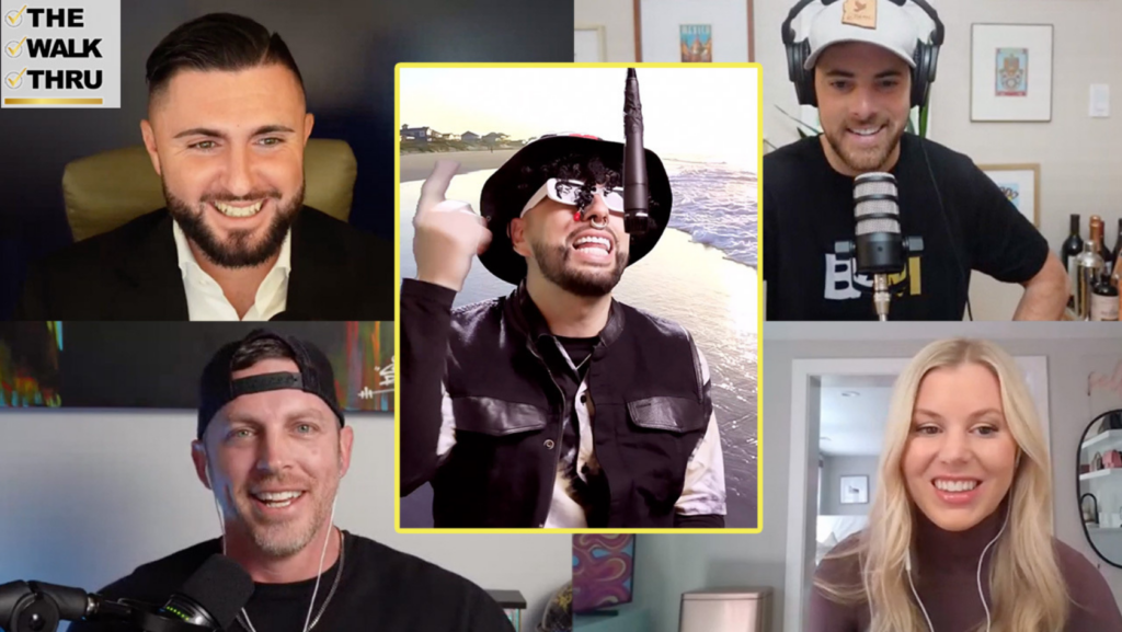 Video call grid with five participants; center guest in a hat and sunglasses speaks into a microphone on a beach backdrop, yellow bordered; logo 'The Walk Thru' top-left.