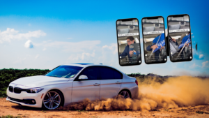 White BMW sedan on a dirt road kicking up orange dust under a bright blue sky, with three smartphones floating in the air showing in-car videos.
