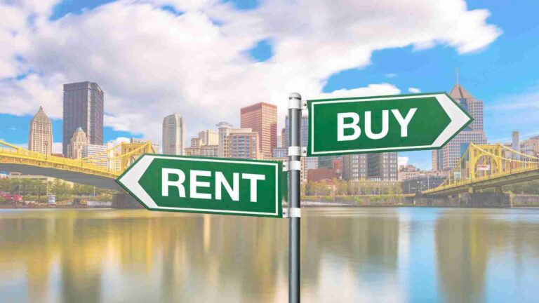 Signpost with green RENT and BUY arrows pointing in opposite directions in front of a city skyline and bridge over water, implying rent vs buy choice.