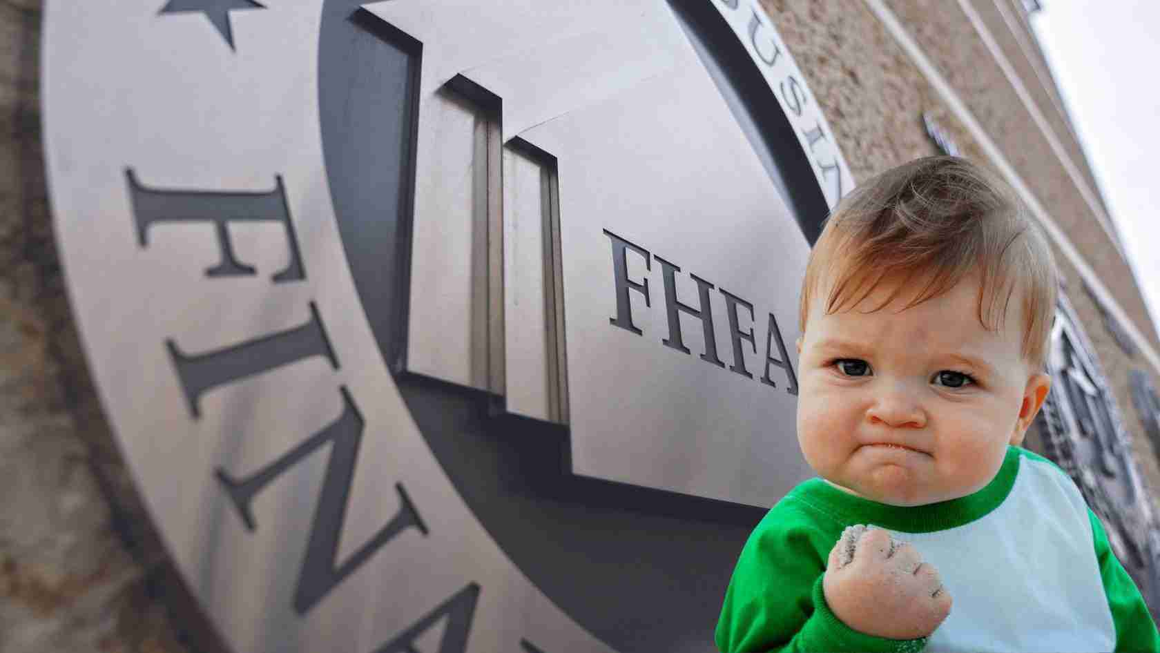 Young child in a green and white shirt stands close to a large circular sign that says “THEATRE,” fist clenched with chalk on his hand.