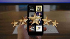 Hand holding a smartphone showing a grid of BAM podcast thumbnails, with large gold star awards floating around the screen.