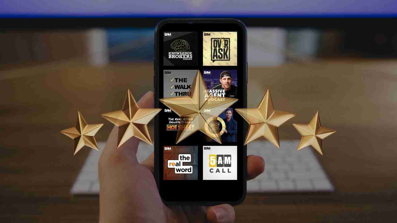 Hand holding a smartphone showing a grid of BAM podcast thumbnails, with large gold star awards floating around the screen.