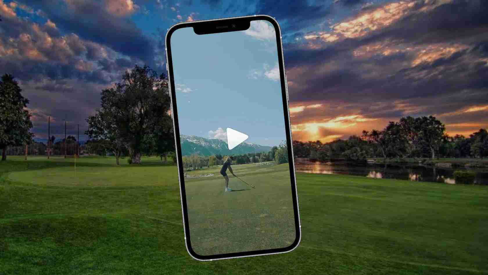 Smartphone tilted on a golf course showing a golfer putting, with a white play button centered on the screen.