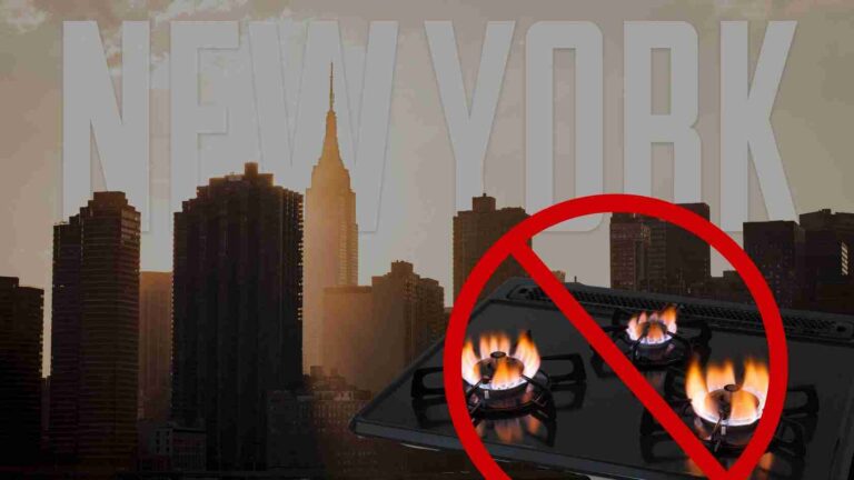 New York City skyline with a large 'NEW YORK' title and a gas stove with flames crossed out by a red prohibition circle, indicating a gas-stove ban.