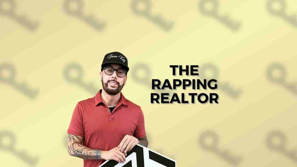 Man with tattoos in a red polo shirt and cap, holding a film clapperboard, beside the text 'The Rapping Realtor' on a pale yellow background.