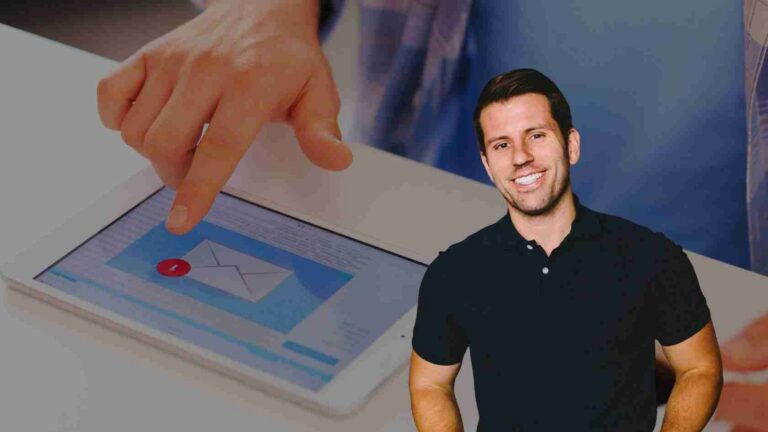 Smiling man in a black polo stands beside a tablet while a finger taps a blue inbox screen with a red notification dot on it.