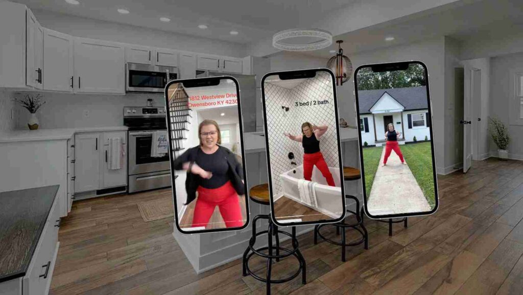 Three smartphone screens on stands display a woman exercising in a modern kitchen setting; outdoor house visible on the right.