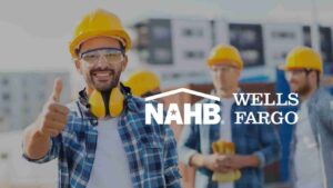 Smiling construction worker in a yellow hard hat gives a thumbs up; NAHB and Wells Fargo logos overlay the background behind him.