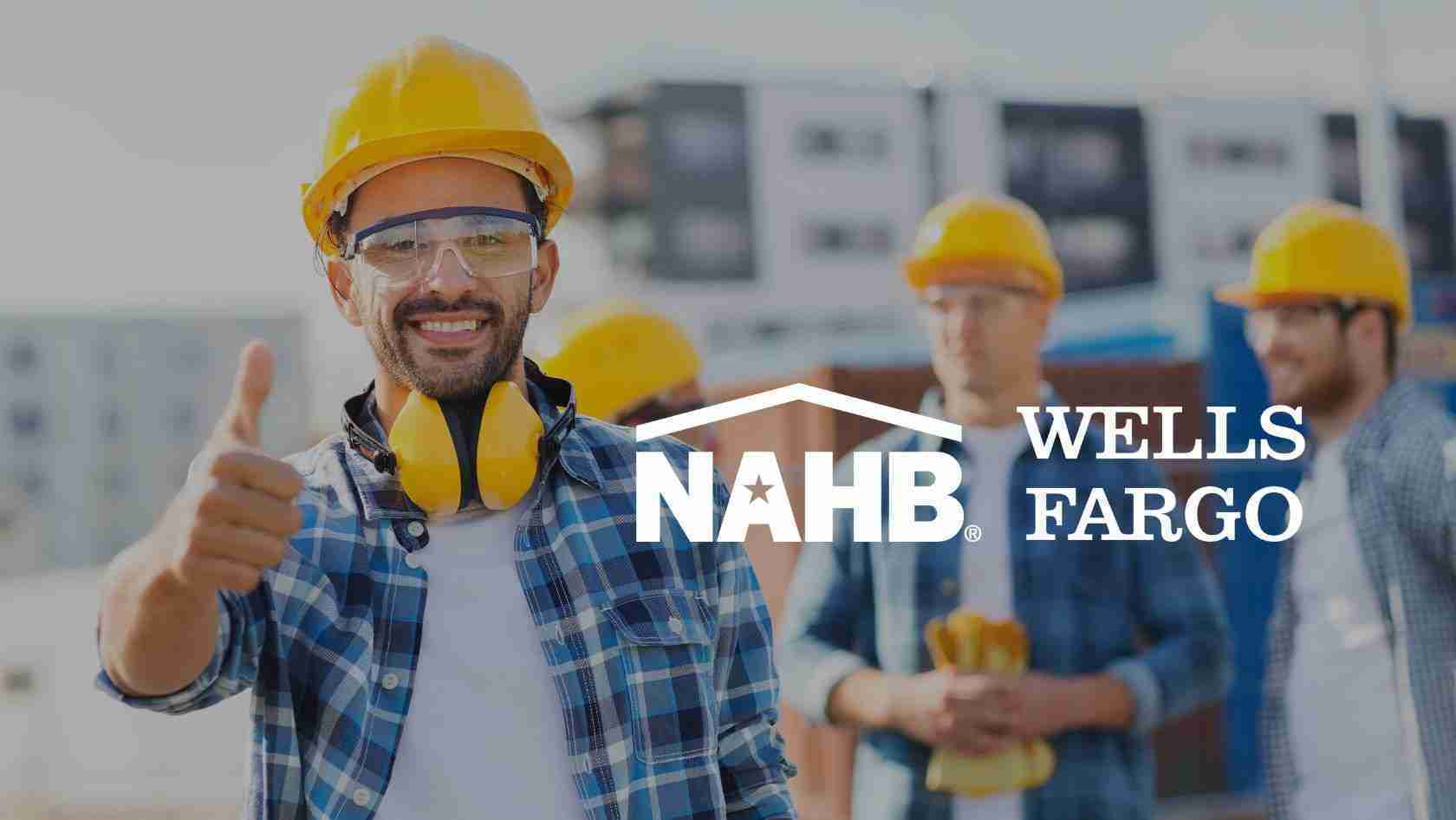 Smiling construction worker in a yellow hard hat gives a thumbs up; NAHB and Wells Fargo logos overlay the background behind him.