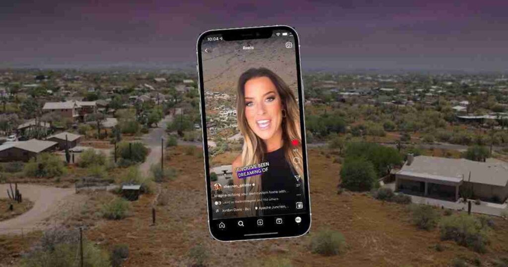A smartphone displaying a video/story on a social app, hovering over a desert suburban landscape.