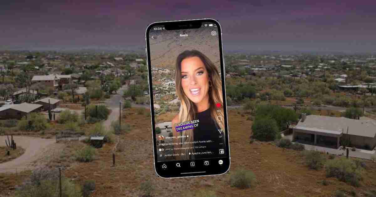 A smartphone displaying a video/story on a social app, hovering over a desert suburban landscape.