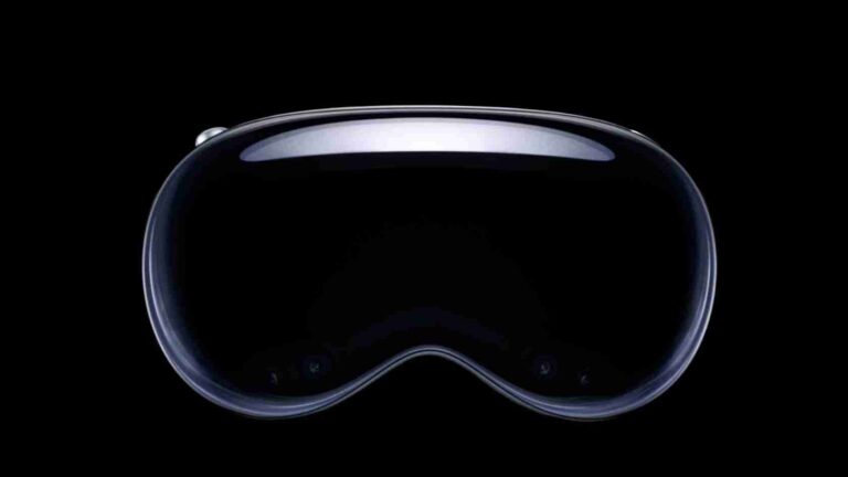 Front view of a glossy black VR headset lens against a black background, with a curved, reflective rim.