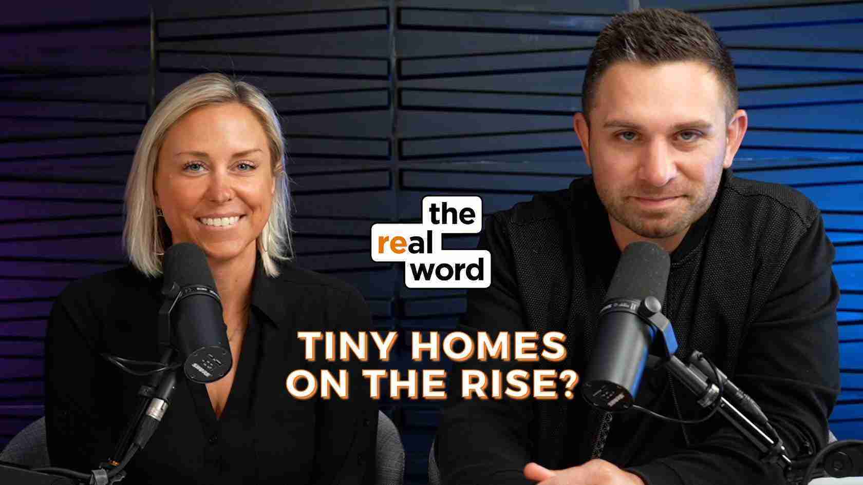 Two podcast hosts sit at a desk with microphones, smiling for the camera in a studio backdrop, logo reads 'the real word' and headline 'Tiny Homes on the Rise?'