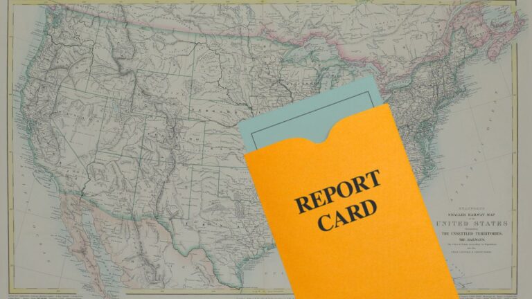 Vintage map of the United States with an orange report card folder laid over it, suggesting a geographic report or assessment tool used for evaluation.