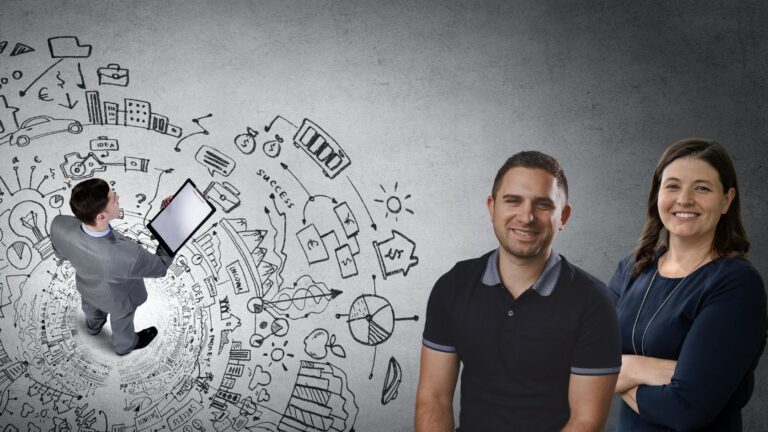 Two smiling colleagues stand together as a teammate with a tablet sketches a chalk-drawn swirl of ideas on the wall.”] ,