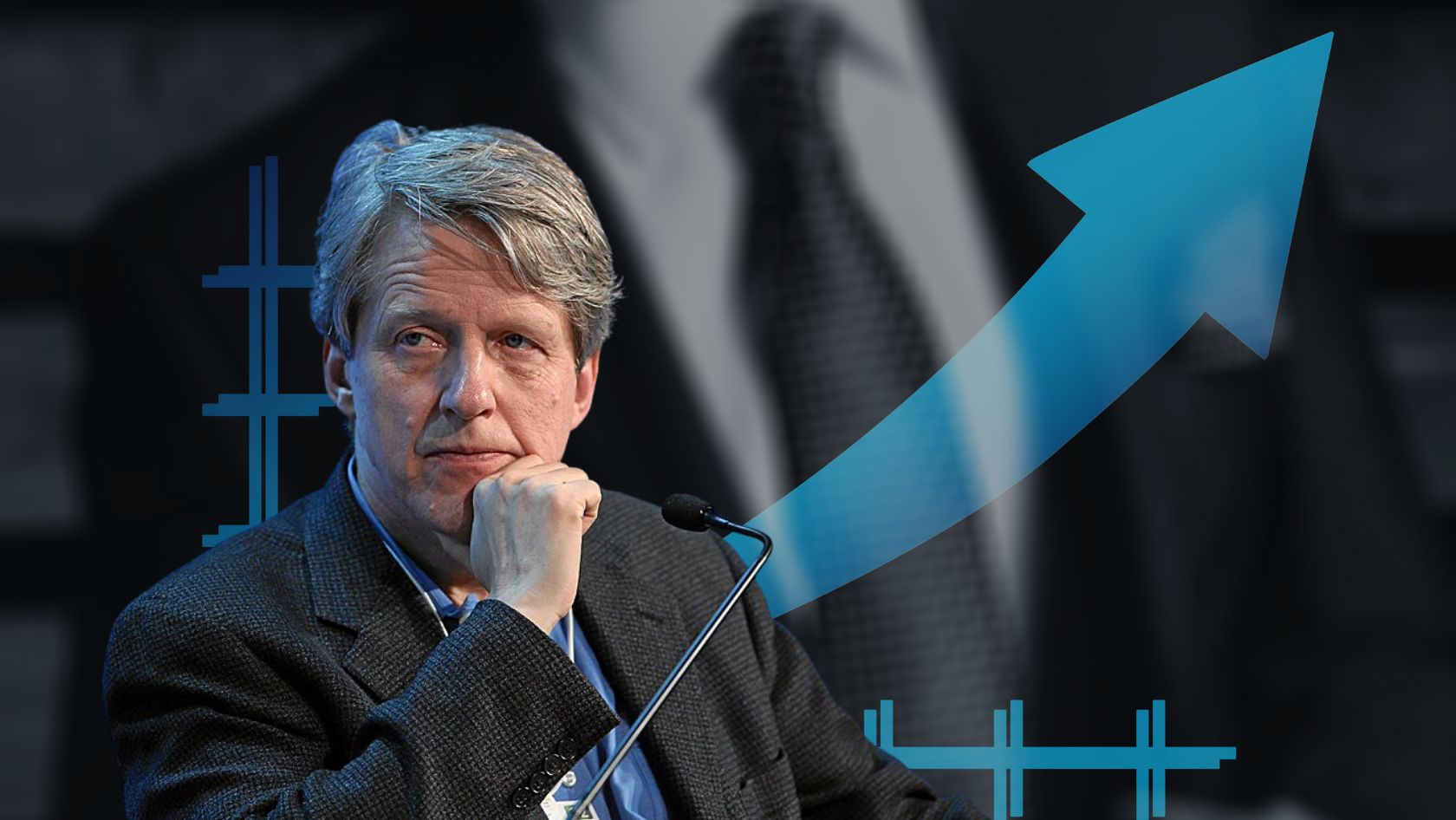 Man in a suit at a podium, resting his chin on his hand, during a conference or press event with a blue rising-arrow graphic in the background.